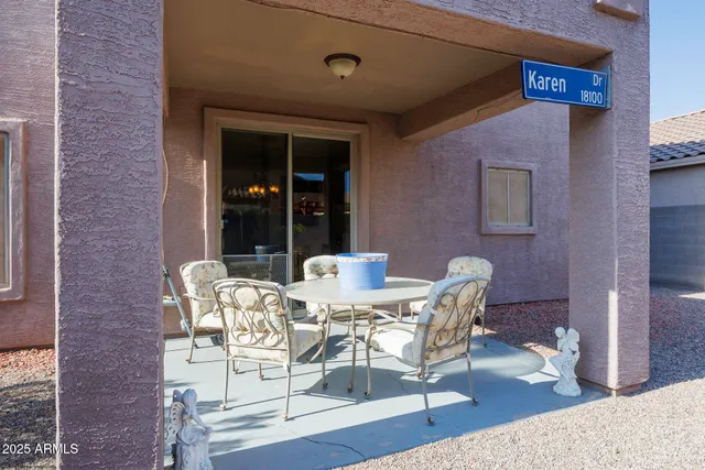 a view of a dining room with furniture and window