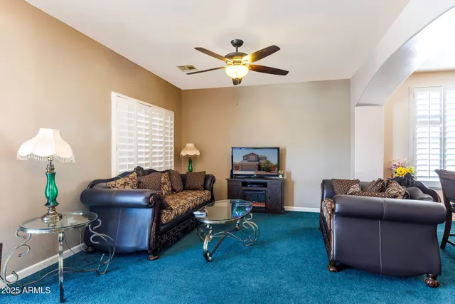 a living room with furniture and a window