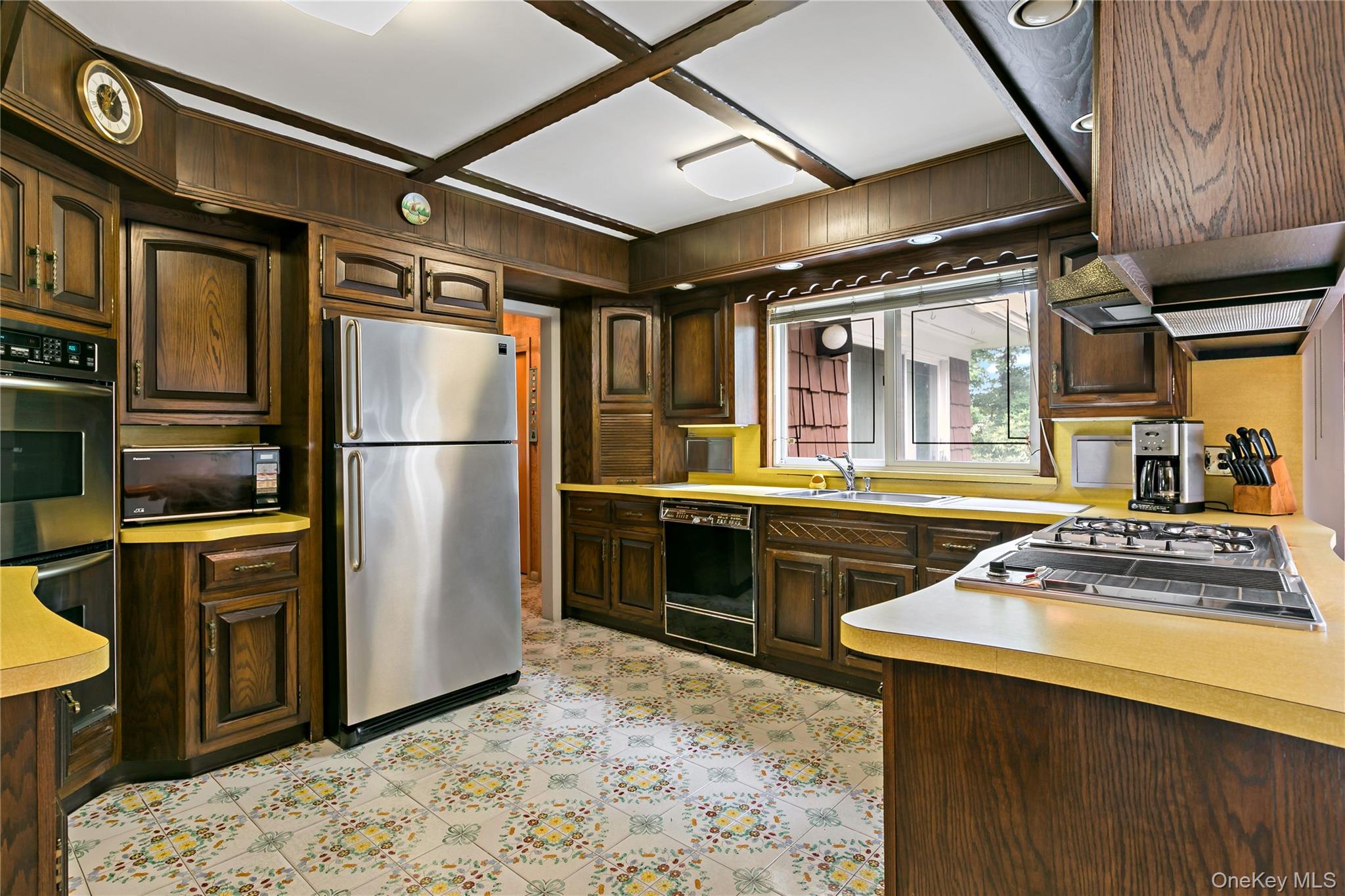 16 Meadow Road Scarsdale, NY 10583 - Photo 11 of 47 a kitchen with stainless steel appliances granite countertop a refrigerator and a stove