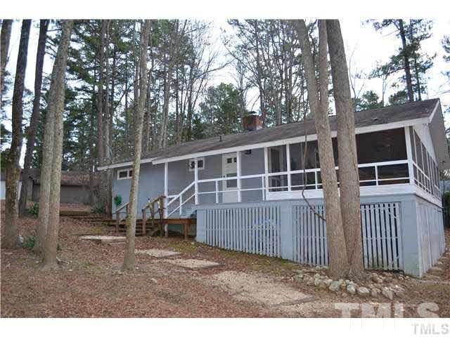3 Fox Road Clarksville, VA 23927 - Photo 17 of 21 a backyard of a house with table and chairs