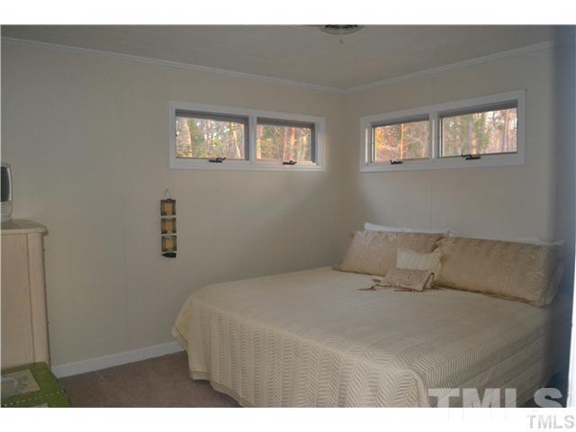 3 Fox Road Clarksville, VA 23927 - Photo 20 of 21 a bedroom with a bed and a night stand