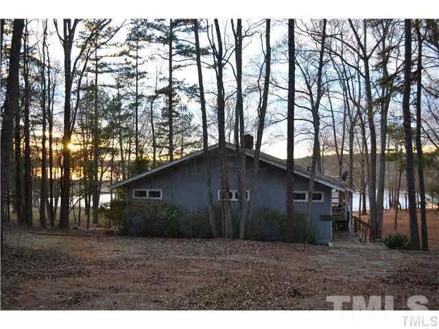 3 Fox Road Clarksville, VA 23927 - Photo 21 of 21 a backyard of a house with large trees and wooden fence