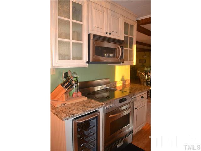 3 Fox Road Clarksville, VA 23927 - Photo 6 of 21 a kitchen with stainless steel appliances granite countertop a stove and a microwave