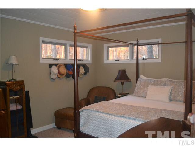 3 Fox Road Clarksville, VA 23927 - Photo 9 of 21 a bedroom with a bed a dresser and a window