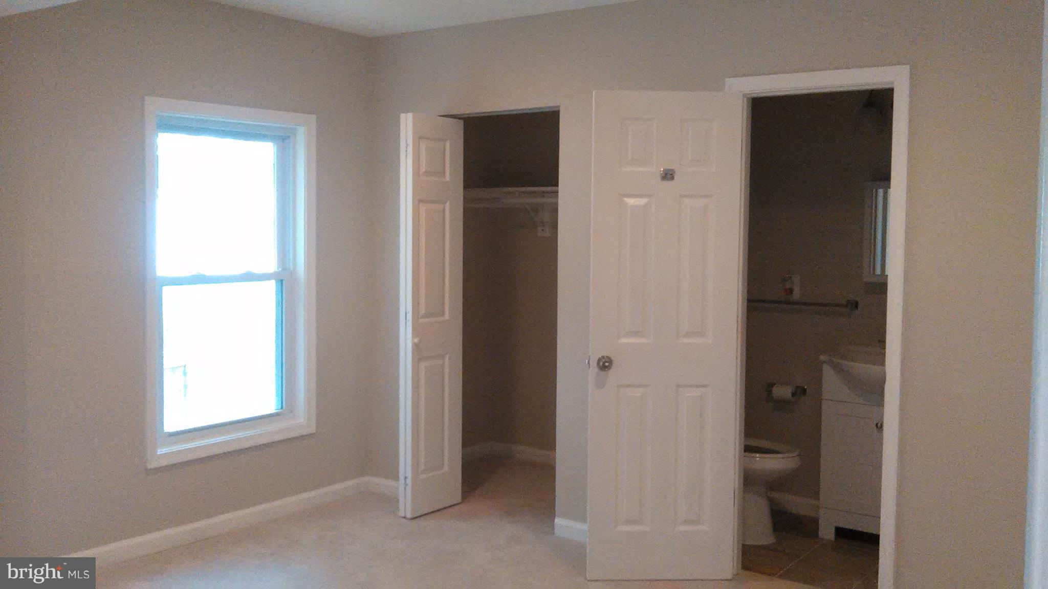 7701 Greenleaf Road Landover, MD 20785 - Photo 11 of 24 a view of an empty room with closet and a window