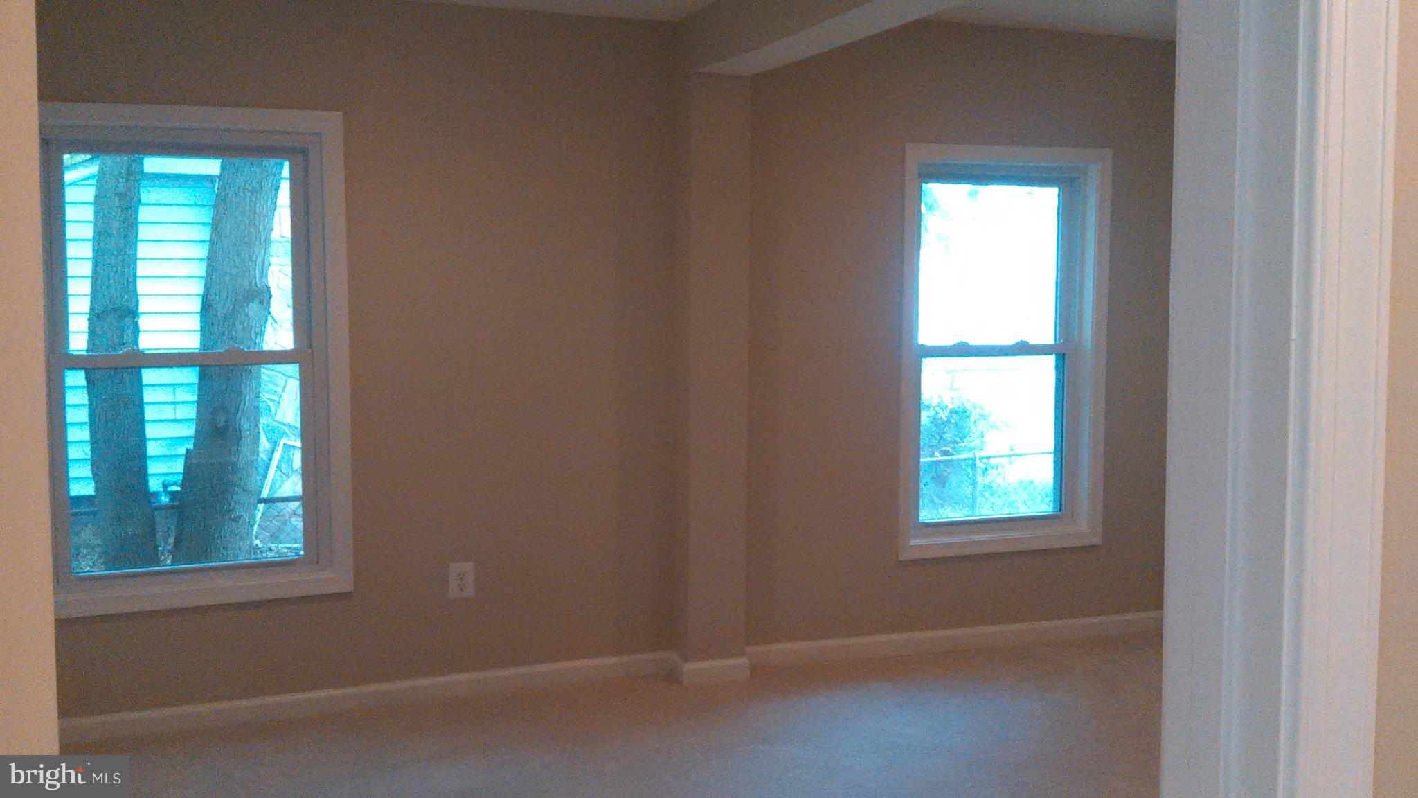 7701 Greenleaf Road Landover, MD 20785 - Photo 13 of 24 an empty room with a window