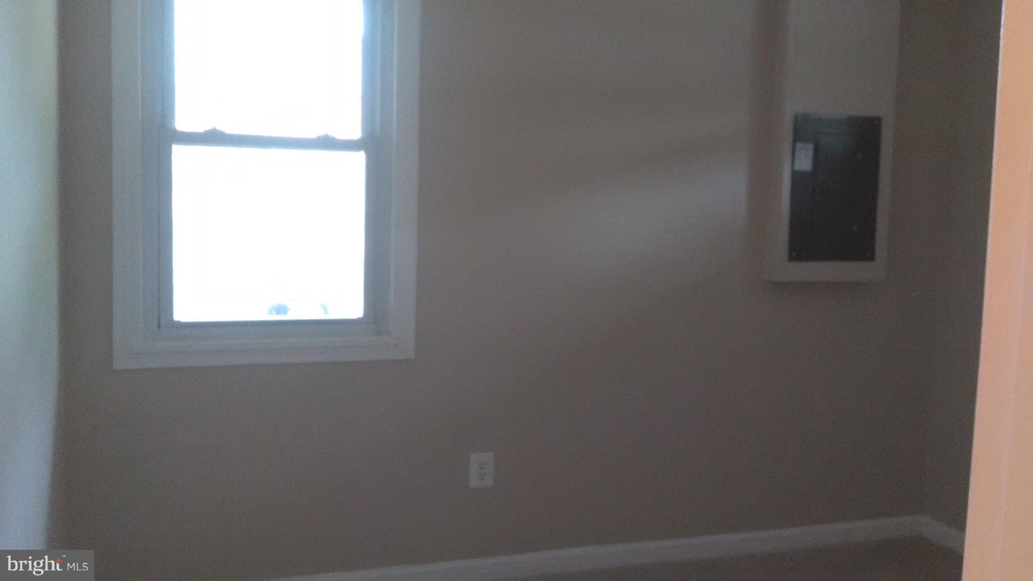 7701 Greenleaf Road Landover, MD 20785 - Photo 14 of 24 an empty room with a window