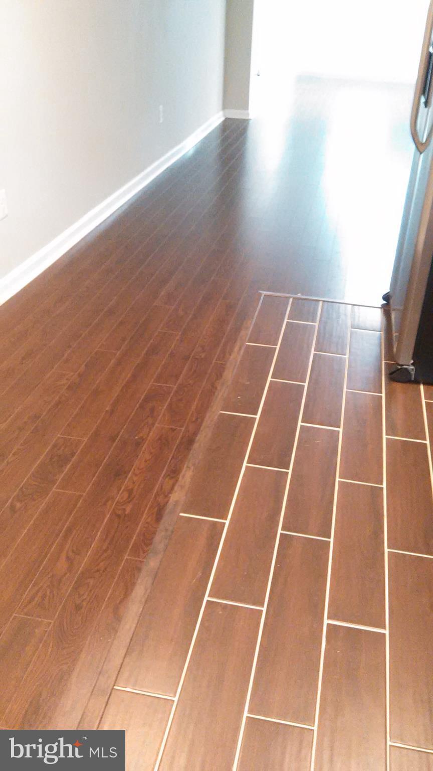 7701 Greenleaf Road Landover, MD 20785 - Photo 20 of 24 a view of an empty room with wooden floor