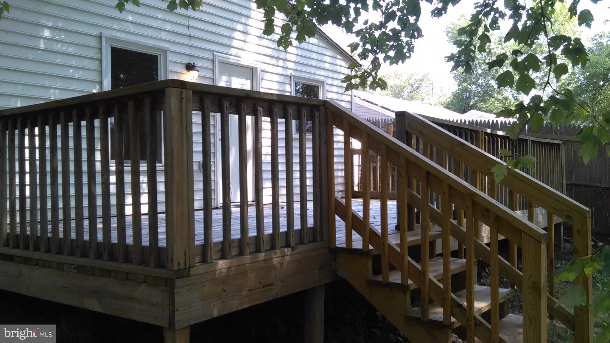 7701 Greenleaf Road Landover, MD 20785 - Photo 5 of 24 a view of balcony with wooden floor and fence