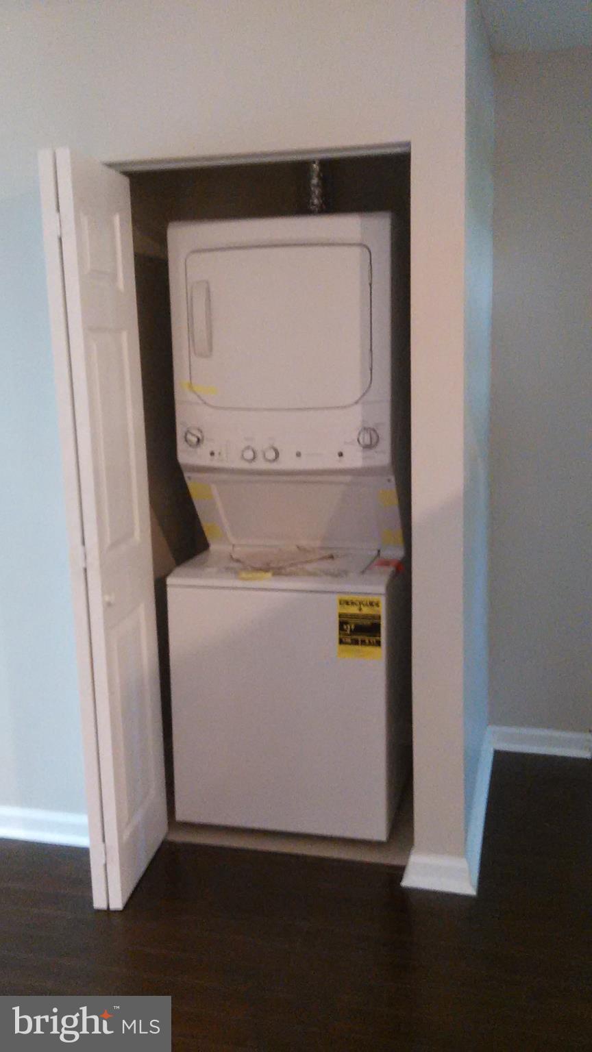 7701 Greenleaf Road Landover, MD 20785 - Photo 9 of 24 a utility room with wooden floor washer and dryer