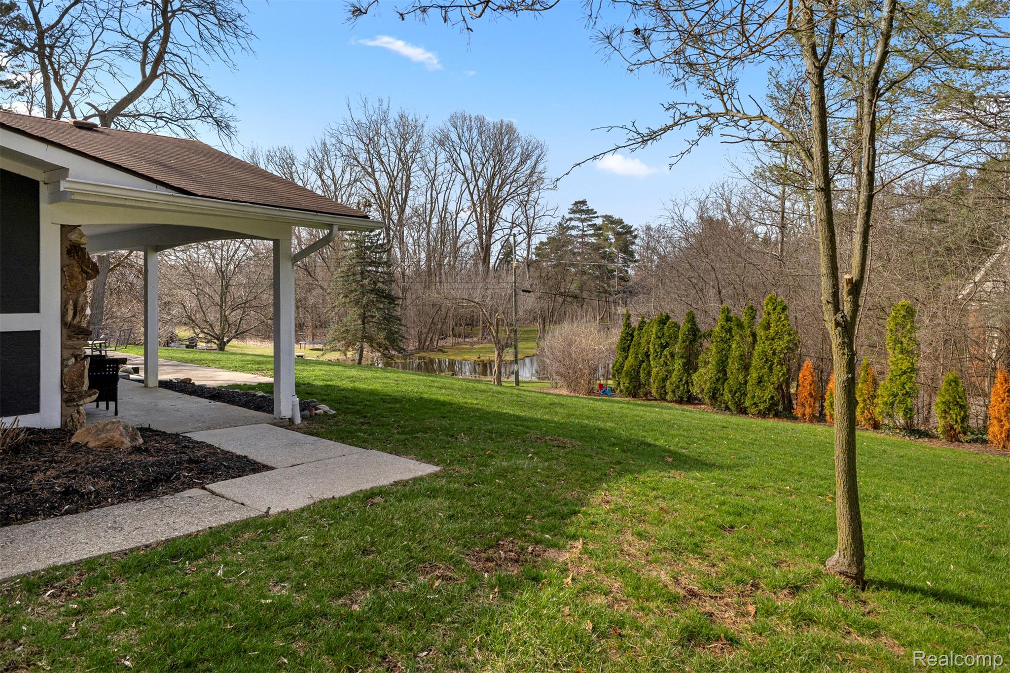 45401 West 9 Mile Road Novi, MI 48374 - Photo 40 of 67 View of grassy yard with a water view and a patio