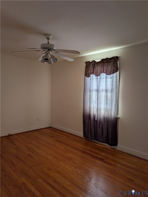 5915 Ridge Road Richmond, VA 23227 - Photo 11 of 17 a view of an empty room with wooden floor and a window