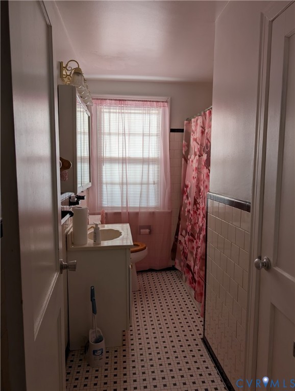 5915 Ridge Road Richmond, VA 23227 - Photo 12 of 17 a bathroom with a sink toilet and shower