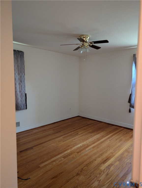 5915 Ridge Road Richmond, VA 23227 - Photo 13 of 17 a view of a room with wooden floor and a ceiling fan
