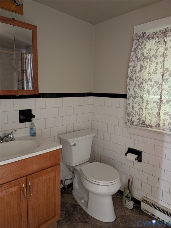 5915 Ridge Road Richmond, VA 23227 - Photo 16 of 17 a bathroom with a toilet sink and mirror
