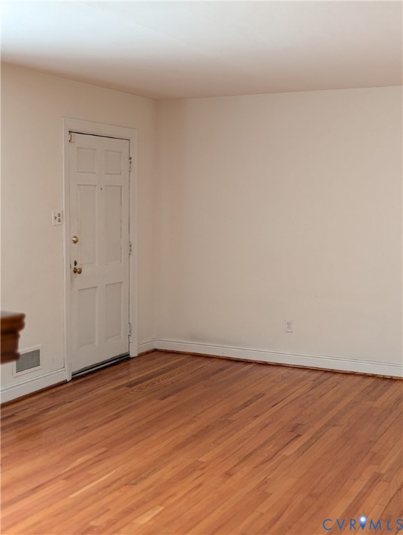 5915 Ridge Road Richmond, VA 23227 - Photo 4 of 17 a view of an empty room with wooden floor