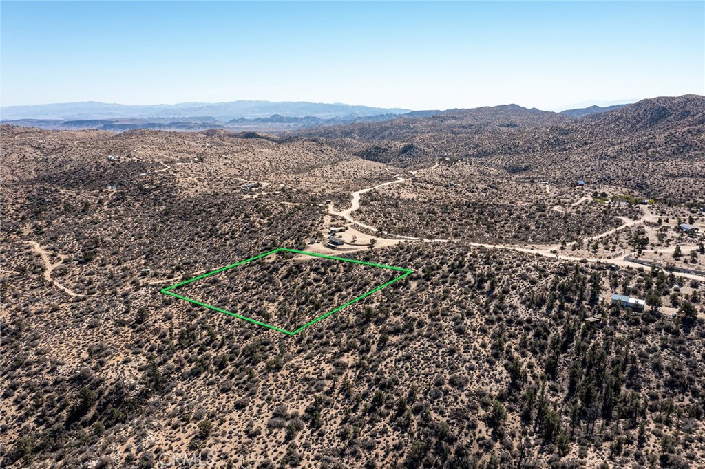 48400 Madison Road Landers, CA 92285 - Photo 4 of 21 an aerial view of house with yard and mountain view in back