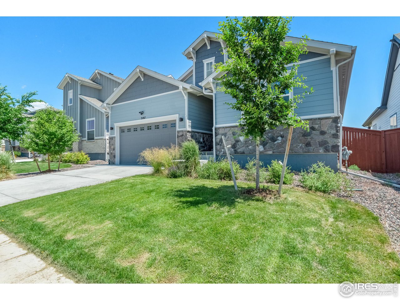 2107 Setting Sun Drive Windsor, CO 80550 - Photo 11 of 40 a view of a front of house with a yard