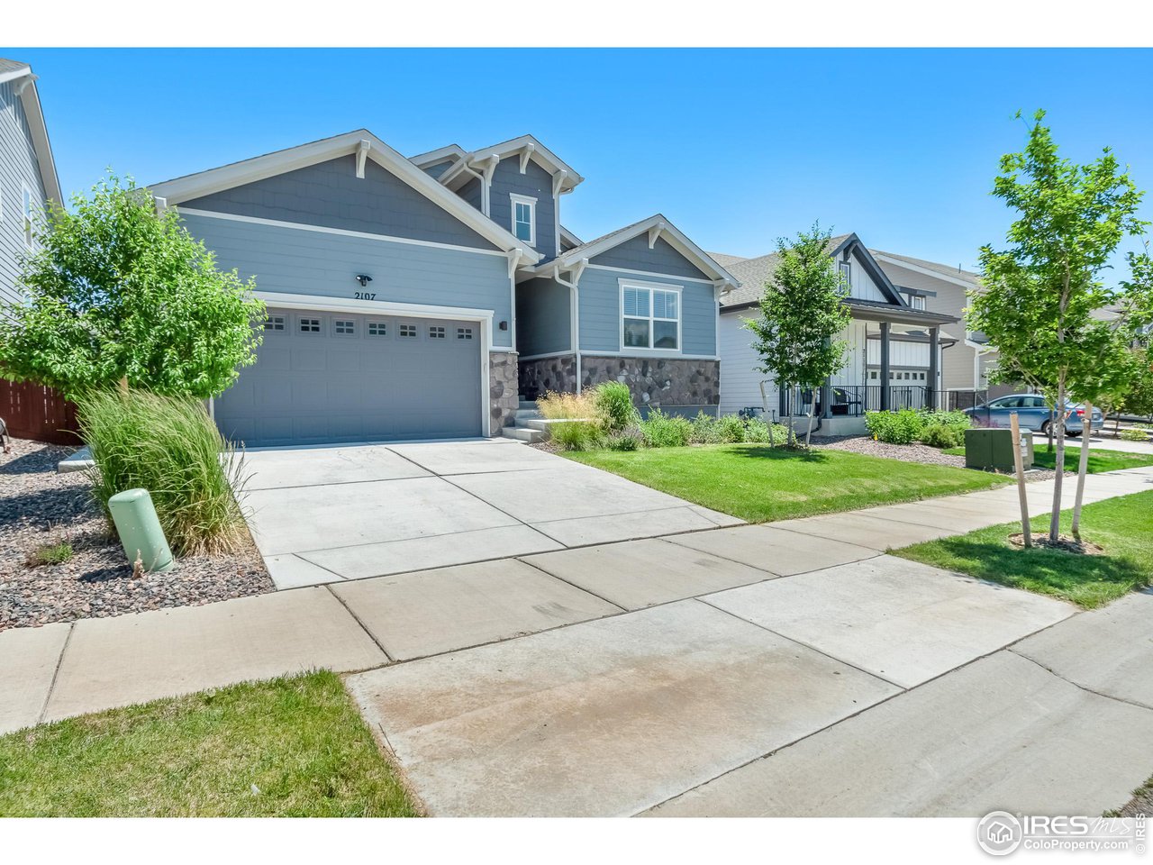 2107 Setting Sun Drive Windsor, CO 80550 - Photo 12 of 40 a front view of a house with garden