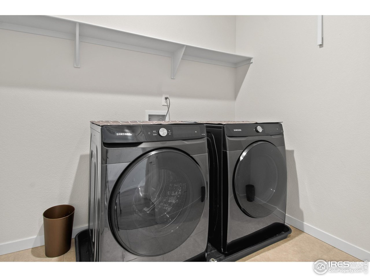 2107 Setting Sun Drive Windsor, CO 80550 - Photo 19 of 40 a utility room with dryer and washer