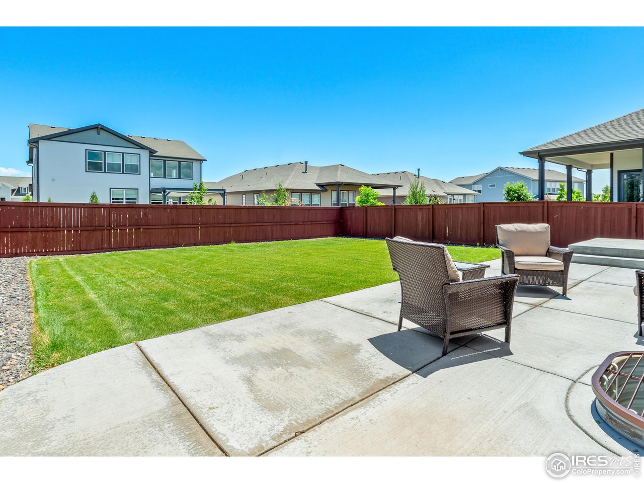 2107 Setting Sun Drive Windsor, CO 80550 - Photo 7 of 40 a view of a backyard with sitting area