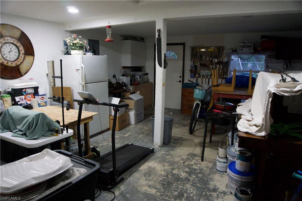 2407 Randall Boulevard Naples, FL 34120 - Photo 11 of 46 a view of a room with gym equipment