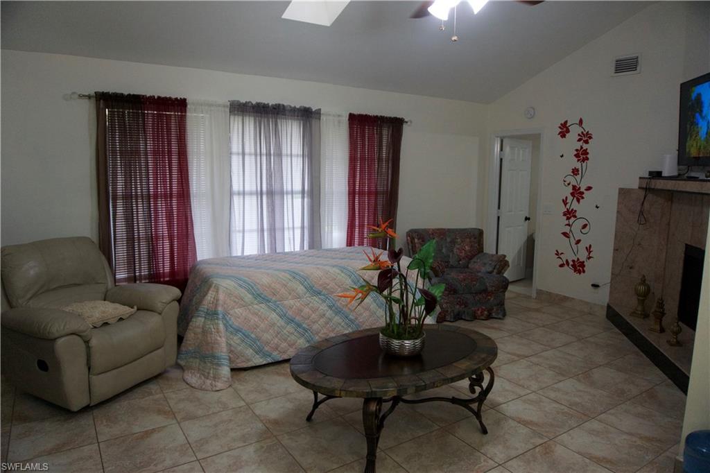 2407 Randall Boulevard Naples, FL 34120 - Photo 30 of 46 a living room with furniture and a potted plant
