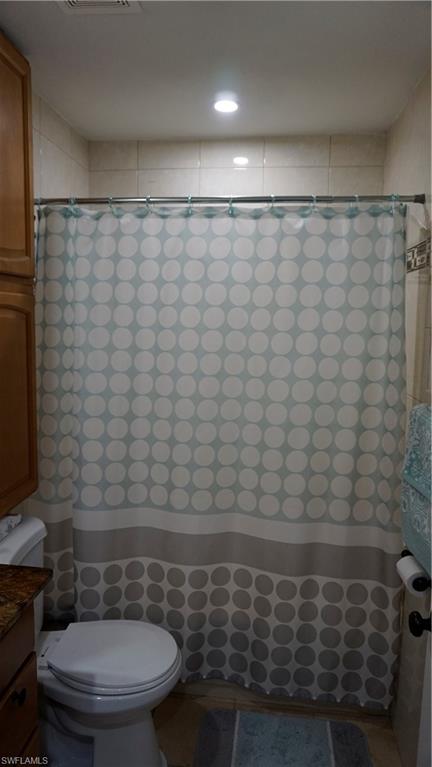 2407 Randall Boulevard Naples, FL 34120 - Photo 33 of 46 a bathroom with a shower and a toilet