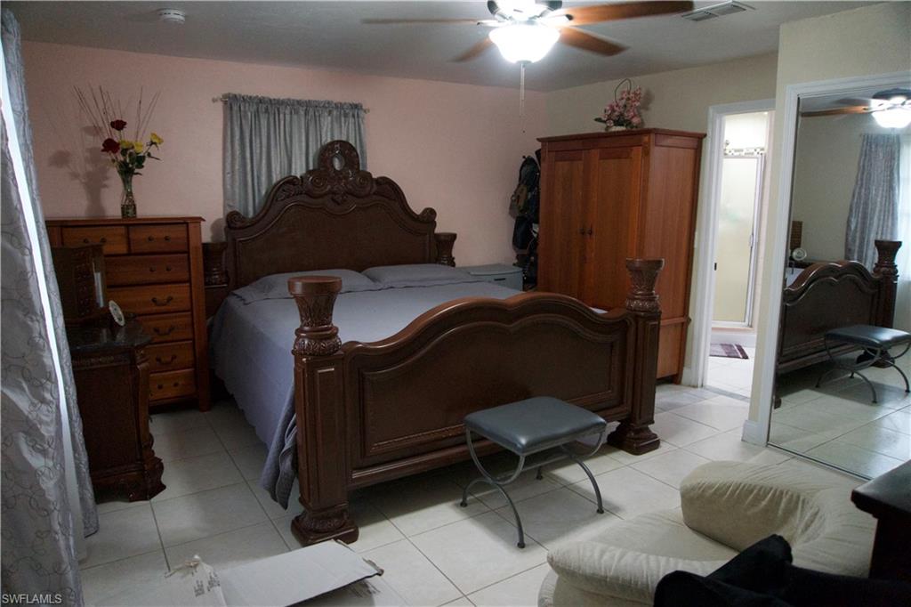 2407 Randall Boulevard Naples, FL 34120 - Photo 37 of 46 a living room with furniture and a closet