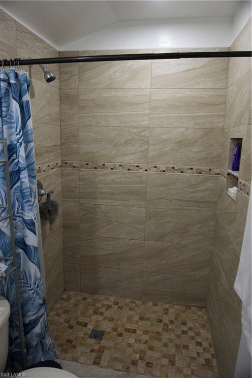 2407 Randall Boulevard Naples, FL 34120 - Photo 44 of 46 a bathroom with a shower