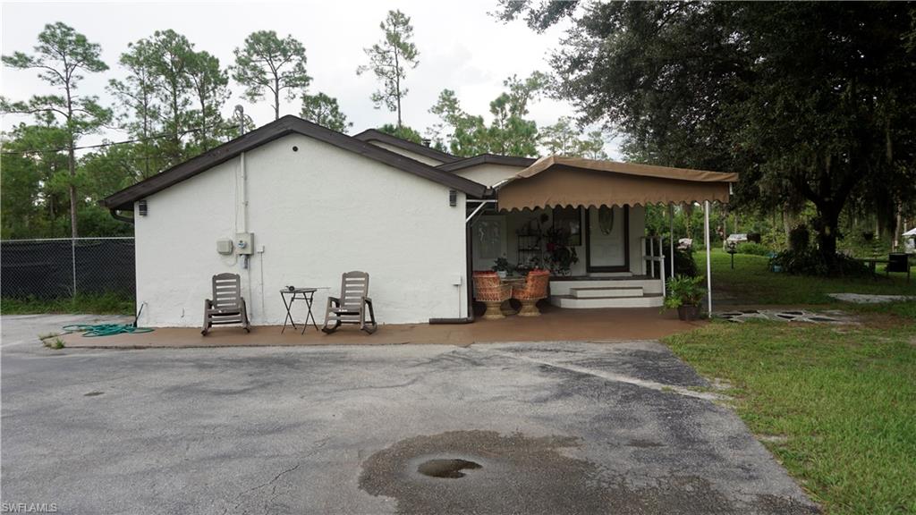 2407 Randall Boulevard Naples, FL 34120 - Photo 7 of 46 a view of a house with backyard