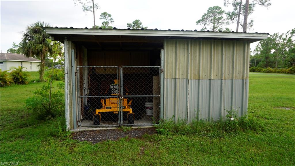 2407 Randall Boulevard Naples, FL 34120 - Photo 9 of 46 a view of outdoor space and yard
