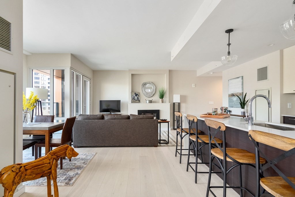 110 Broad Street, Unit 501 Boston, MA 02110 - Photo 14 of 41 a view of a dining room with furniture and chandelier
