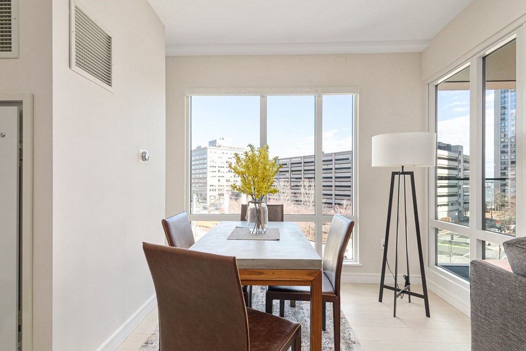 110 Broad Street, Unit 501 Boston, MA 02110 - Photo 15 of 41 a dining room with furniture and wooden floor