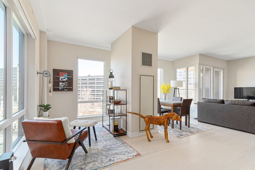 110 Broad Street, Unit 501 Boston, MA 02110 - Photo 21 of 41 a living room with furniture and a large window