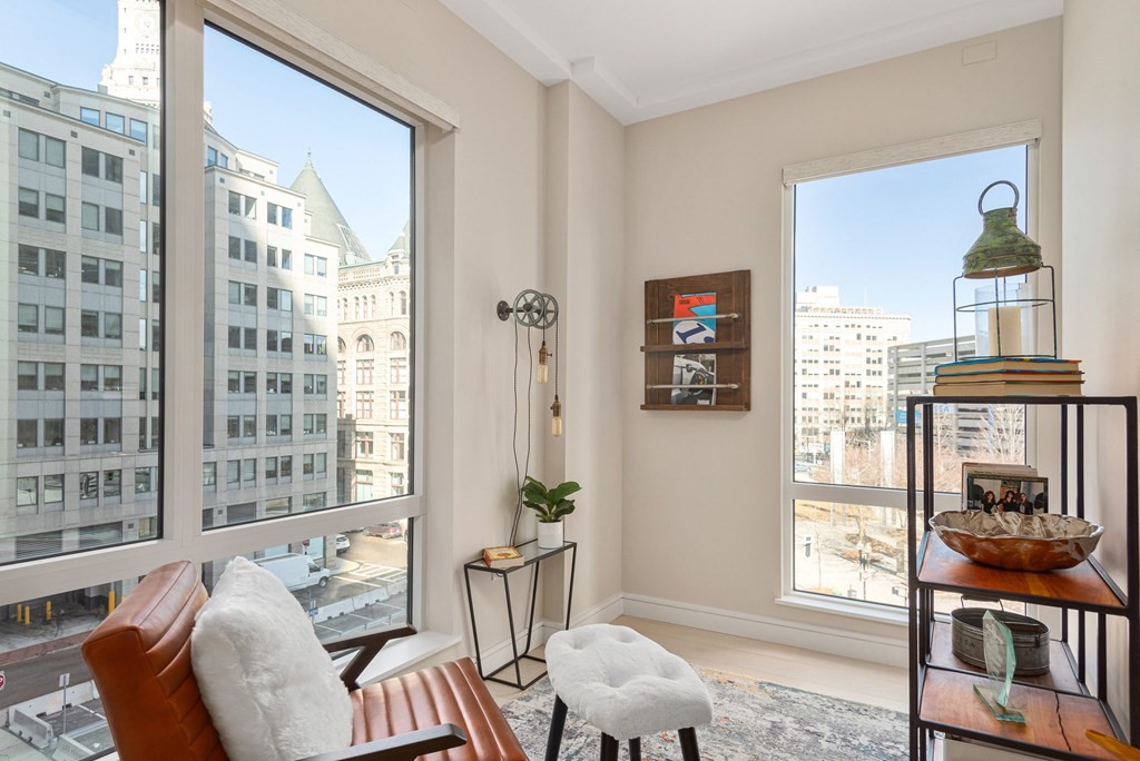 110 Broad Street, Unit 501 Boston, MA 02110 - Photo 22 of 41 a living room with furniture and a window