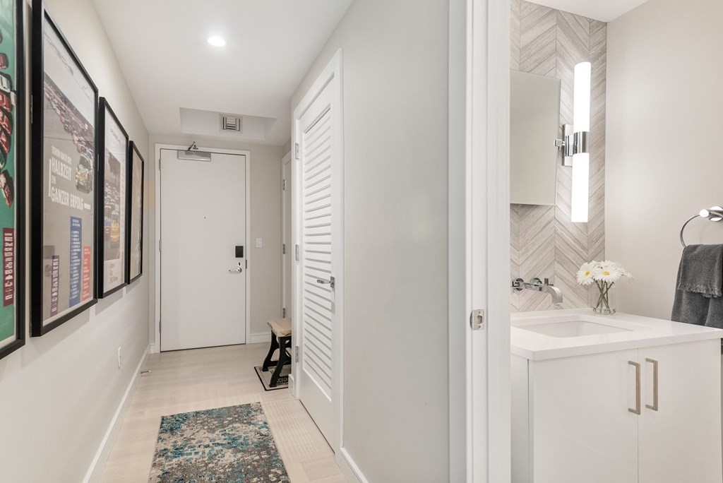 110 Broad Street, Unit 501 Boston, MA 02110 - Photo 3 of 41 a bathroom with a sink a toilet and shower