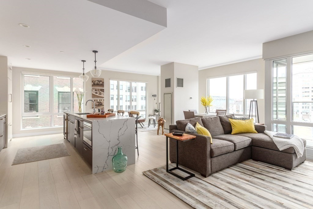 110 Broad Street, Unit 501 Boston, MA 02110 - Photo 31 of 41 a living room with furniture and a large window