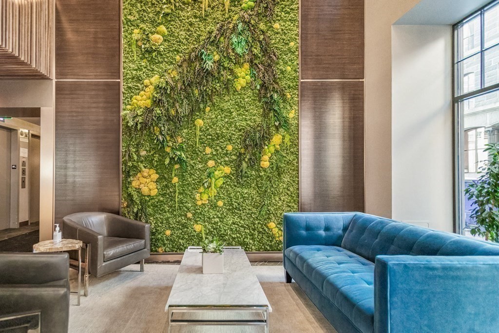 110 Broad Street, Unit 501 Boston, MA 02110 - Photo 36 of 41 a living room with furniture and a potted plant