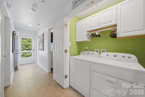 a view of storage and utility room with washer and dryer