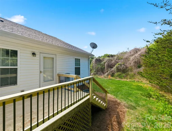 a view of balcony with yard and outdoor seating