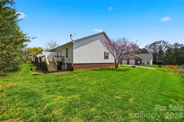 a view of a house with a back yard