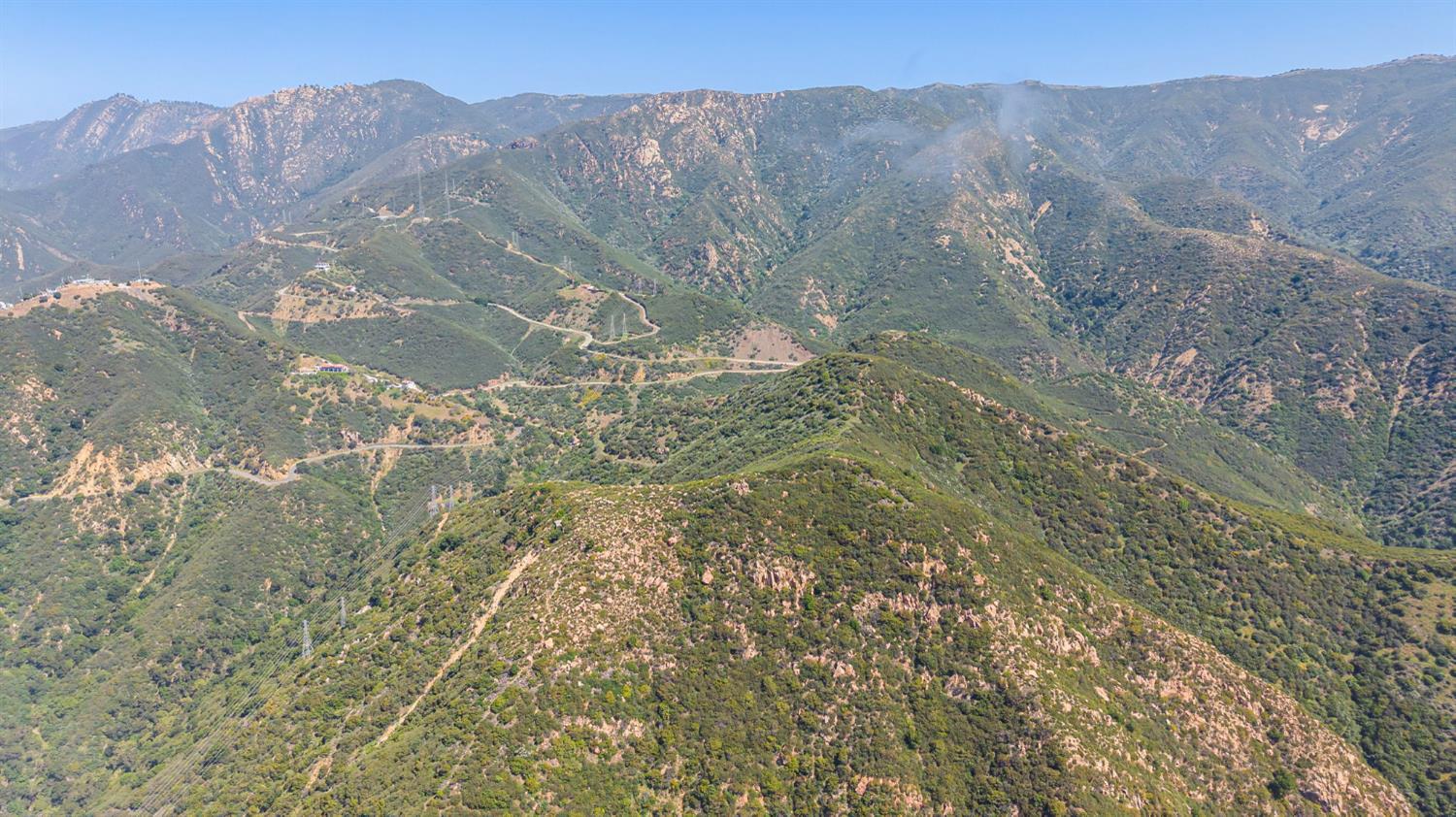 2888 Gibraltar Road Santa Barbara, CA 93105 - Photo 11 of 24 a view of a dry yard with mountains in the background