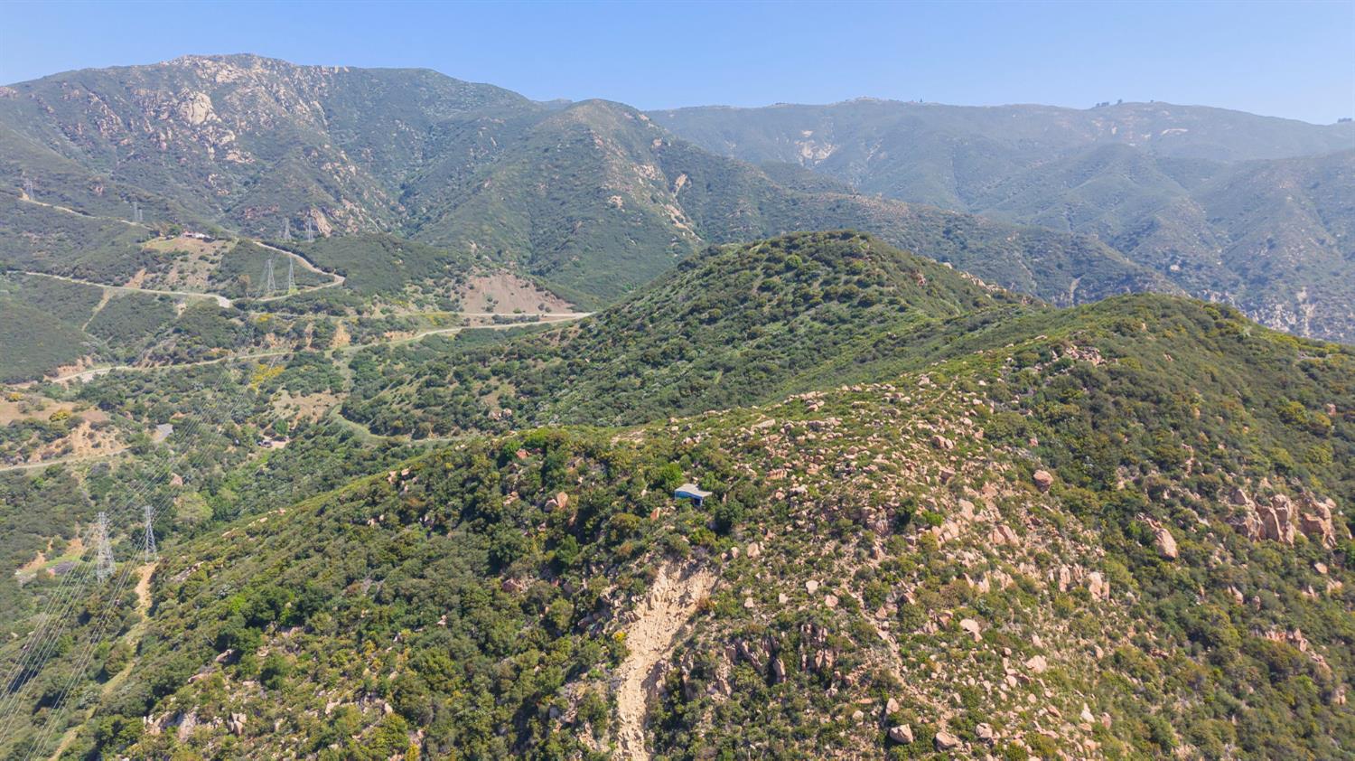 2888 Gibraltar Road Santa Barbara, CA 93105 - Photo 12 of 24 a view of a dry yard with mountains in the background