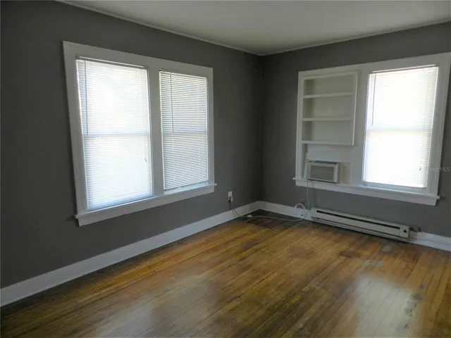 a view of an empty room with a window