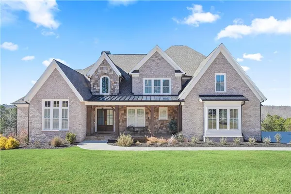 front view of a house with a yard