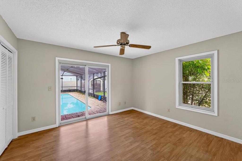 16 Fox Hollow Drive Ormond Beach, FL 32174 - Photo 13 of 38 wooden floor in an empty room with a window