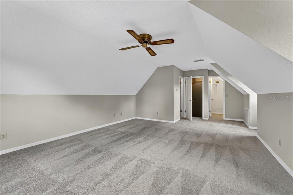 16 Fox Hollow Drive Ormond Beach, FL 32174 - Photo 22 of 38 a view of a livingroom with a ceiling fan and window
