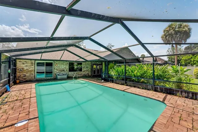 a view of swimming pool with a patio