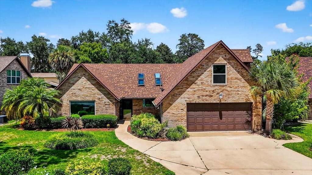 16 Fox Hollow Drive Ormond Beach, FL 32174 - Photo 38 of 38 a front view of a house with a garden